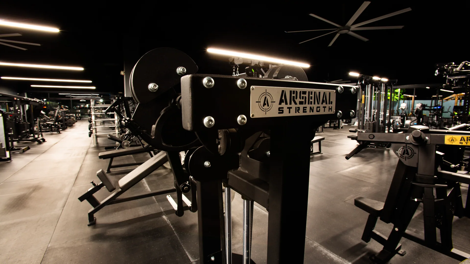 Arsenal Strength signage above the bench area on the training floor