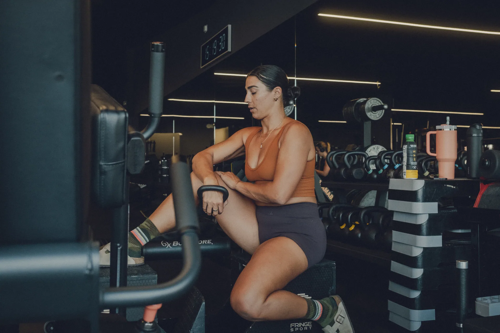 Member training on a seated leg machine