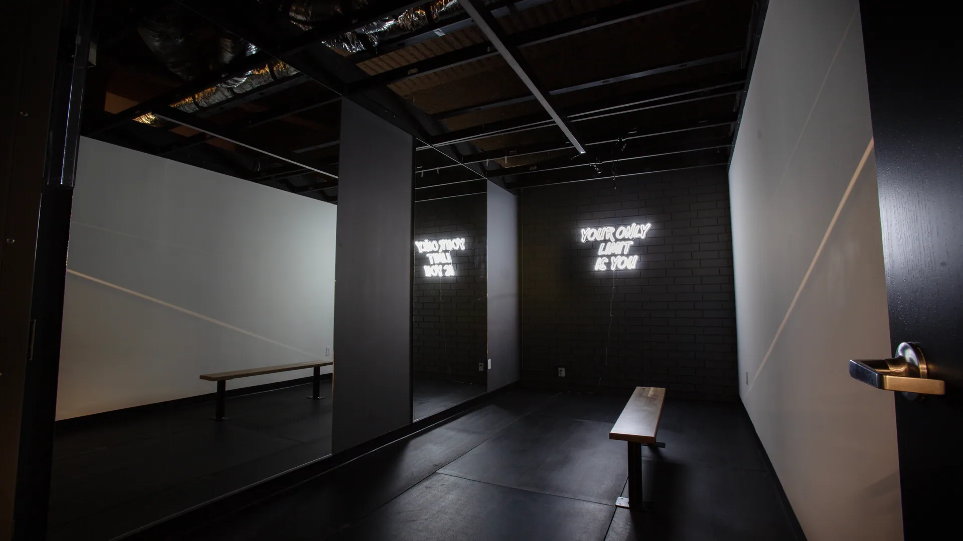 Quiet stretching and warm-up area with dark walls